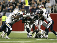 Patriots running back Laurence Maroney bursts through a group of would-be tacklers against the Chargers in week 2.