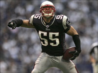 New England Patriots linebacker Junior Seau reacts after he intercepted the Dallas Cowboys quarterback Tony Romo during the 4th quarter of their Week 6 game.