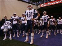 Tom Brady and the New England Patriots wait to be introduced before the start of their game against the Indianapolis Colts at the RCA Dome on Sunday, November 4, 2007.