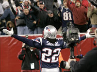 New England Patriots cornerback Asante Samuel shows off the ball to the fans in the end zone after his 2nd interception of the game late in the 4th quarter against the Philadelphia Eagles.