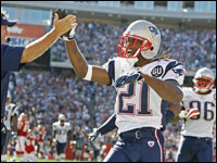 Patriots cornerback Deltha O'Neal gets a high-five from coach Bill Belichick after a huge play in the fourth quarter against Kansas City.