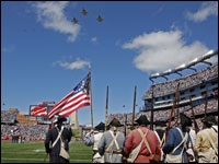 Fighter jets fly over Gillette Stadium as the minutemen stand guard before the Patriots' 2008 season opener.
