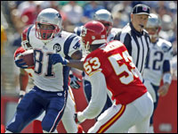 Patriots wide receiver Randy Moss looks for running room against the Kansas City Chiefs in the Patriots' 2008 season opener.
