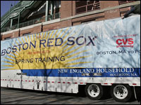Red Sox equipment for spring training gets loaded up onto a van with a banner outside Fenway Park.  (Globe Staff Photo/ Suzanne Kreiter)