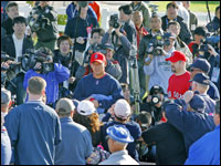   Daisuke Matsuzaka is the center of attention of both fans and media as he and catcher Jason Varitek (behind him with goatee) head from the clubhouse to the field for the first official workout of Spring Training.   (Globe Staff Photo/ Jim Davis)