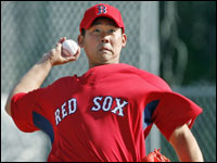 Daisuke Matsuzaka threw off of a mound and in uniform this morning for the first time during the first official workout of Spring Training.  (Globe Staff Photo/ Jim Davis)