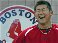  Daisuke Matsuzaka,during a post practice press availability cracks up when he is asked a question about why he carried Jason Varitek's equipment bag onto the field for him as they took the field for this morning's first official workout.   (Globe Staff Photo/ Jim Davis)