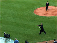Before his press conference, Daisuke Matsuzaka went to the mound at Fenway Park and threw a pitch to Red Sox owner John Henry, (which he missed), and after he missed he fell backwards, which brought a howl of laughter from the pitcher as his agent Scott Boras (bottom right), rushed to Henry's aid.  (Globe Staff Photo/ Jim Davis)