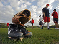 It might be wintry in Boston, but in Fort Myers, Florida, the grass is green, and the sky is blue with puffy white clouds as some of the Red Sox pitchers, (including Jonathan Pabelpon, at right with high white socks) catchers and younger position players who are already in camp are seen loosening up before working out.  (Globe Staff Photo/ Jim Davis)