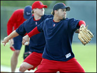 Red Sox pitchers Manny Delcarmen (front) and Jonathan Papelbon (rear) throw at the same time as they work in the bullpen area this morning.   (Globe Staff Photo/ Jim Davis)