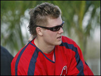 Red Sox pitcher Jonathan Papelbon sports sunglasses, with a palm tree in the backround as he chats outside the clubhouse after working out.   (Globe Staff Photo/ Jim Davis)