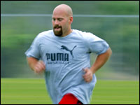 Red Sox infielder Kevin Youkilis arrived at camp today and wasted no time in getting on the field and doing some running by himself.    (Globe Staff Photo/ Jim Davis)