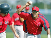 Red Sox shortstop Julio Lugo chases a runner during a rundown drill during today's workout.   (Globe Staff Photo/ Jim Davis)