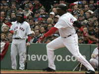 Manny Ramirez (left) watched David Ortiz's first at bat in the first inning.  (Globe Staff Photo/ Barry Chin)