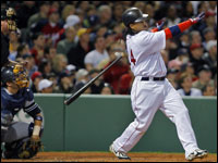 The Red Sox hit four consecutive home runs off of Yankees starter Chase Wright in the third inning, Manny Ramirez got it started as he flips his bat while admiring his blast. (Globe Staff Photo/ Jim Davis)