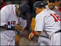  Red Sox pitcher Daisuke Matsuzaka exchanges bows with DH David Ortiz following his complete game 7-1 victory over the Detroit Tigers at Fenway Park. (Globe Staff Photo/ Jim Davis)