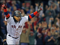 Manny Ramirez won a wild one for the Red Sox  with a bottom of the eighth inning solo home run, his second round tripper of the night, as Boston defeated the Mariners 8-7 at Fenway Park.Here he raises his arms in triumph as the crowd goes wild in the backround as the ball sails out of the park.  (Globe Staff Photo/ Jim Davis)
