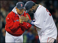  Daisuke Matsuzaka (left) and David Ortiz (right) bow to each other as the Red Sox celebrate their victory on the field over the Oakland A's. (Jim Davis/Globe Staff) 