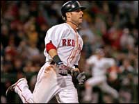  Dustin Pedroia heads to 1st as J.D. Drew in background comes home in the fourth inning against the San Francisco Giants.  - (Globe Staff Photo / Barry Chin)