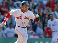  The Red Sox' Julio Lugo (left) gives it his all as he goes full speed down the first base line after he hit the ground ball that ended up scoring teammate Jason Varitek (backround right heading for the plate) with the game-tying run, soon to be followed by Eric Hinske (not pictured) with the winning run as Boston scored six runs in the bottom of the ninth inning to stun the Orioles 6-5. (Jim Davis/Globe Staff) 