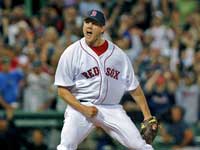  The crowd erupts as Red Sox closer Jonathan Papelbon howls as he strikes out Todd Helton swinging to end the game and preserve Tim Wakefield's 2-1 victory over the Rockies on June 12th. (Jim Davis/Globe Staff)