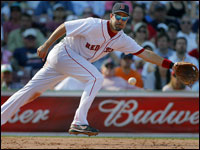  On July 15th, in the ninth inning, Mike Lowell ranged wide to his left and snagged a ball hit by Jason Phillips, and when he spun and fired a strike to first, his glasses also went astray. (Jim Davis/Globe Staff)