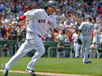  Manny Ramirez glides around first base after he belted a first inning three run home run off of Chicago starter Jon Garland, backround right. (Jim Davis/Globe Staff)