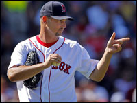  Red Sox pitcher Tim Wakefield gives a friendly point to 2B Alex Cora after he made a nice play to retire Chicago's Alex Cintron in the sixth inning. (Jim Davis/Globe Staff) 