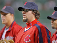  Red Sox pitcher Eric Gagne (center) walks from the bullpen into the Boston dugout with some of the other middle relievers (including Mike Timlin (left) and Manny Delcarmen (right) after they had watched closer Jonathan Papelbon shut down the Orioles in the ninth inning and get the save in the home team's 5-4 victory.  (Jim Davis/Globe Staff)