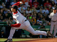   Boston Red Sox pitcher Josh Beckett pitches against the Yankees on September 15th. (Barry Chin/Globe Staff)