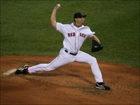   Boston Red Sox pitcher Josh Beckett fires a pitch during the fourth inning of Game 1 of the ALDS between the Red Sox and Angels at Fenway Park. (Stan Grossfeld/Globe Staff)