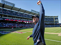   Curt Schilling acknowledges the cheers of Red Sox fans behind the dugout as he heads in to join the party in the clubhouse after the Red Sox swept the Angels in the American League Divisional Series. (Jim Davis/Globe Staff)