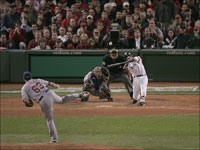   Dustin Pedroia hits a two-run home run in the seventh inning of Game 7 of the ALCS to put the Red Sox up 5-2.  (Bill Greene/Globe Staff)