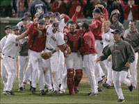   Red Sox players celebrate on the field at Fenway Park after defeating the Cleveland Indians in Game 7 of the ALCS.  The win sent the Red Sox to the World Series.  (Bill Greene/Globe Staff)