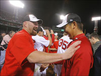   Kevin Youkilis and Game 7 winner Daisuke Matsuzaka celebrate after defeating the Cleveland Indians in Game 7 of the ALCS. (Jim Davis/Globe Staff)
