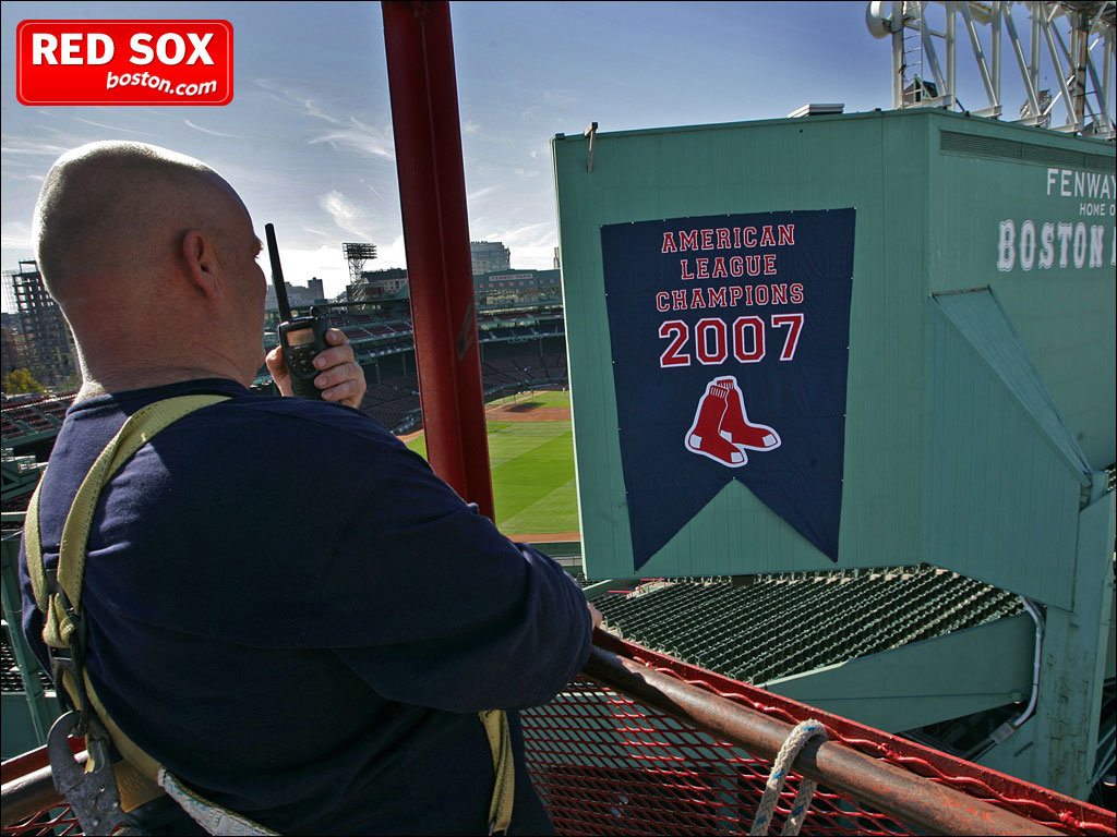 Michael Patti watches the AL championship pennant get hung up at Fenway Park 