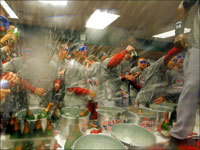   The Boston Red Sox celebrate their 2007 World Series championship in the clubhouse. (Jim Davis/Globe Staff)