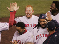   Red Sox outfielder Bobby Kielty gets congratulations from his teammates after he blasted a seventh-inning pinch-hit home run off of Brian Fuentes in Game 4 of the World Series. (Bill Greene/Globe Staff)
