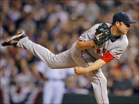  Red Sox starter Jon Lester fires a pitch against the Colorado Rockies in Game 4 of the World Series. (Jim Davis/Globe Staff)
