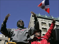   Red Sox player David Ortiz cheers along the Red Sox rolling rally on Boylston Street in Copley Square. (Bill Greene/Globe Staff)