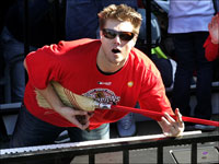   Jonathan Papelbon plays the 'air broom' during the Red Sox's rolling rally.  (Barry Chin/Globe Staff)