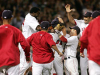   Red Sox players mobbed Clay Buchholz on the mound after the rookie completed his no-hitter. (David Kamerman/Globe Staff)