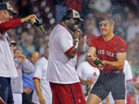   Tim Wakefield (left), David Ortiz and Jonathan Papelbon celebrated on the field. The Red Sox clinched the 2007 American League East Championship with a victory over the Minnesota Twins, combined with the Yankees loss to the Orioles in Baltimore. (Jim Davis/Globe Staff)
