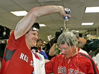   Red Sox owner John Henry gets a shower courtesy of pitcher Jonathan Papelbon. (Barry Chin/Globe Staff)