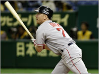 Right fielder J.D. Drew smokes a grand slam against the Yomiuri Giants. (Barry Chin/Globe Staff)