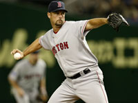 Sox starter Tim Wakefield delivers his signature knuckleball in an exhibition against the Yomiuri Giants.  (Barry Chin/Globe Staff)