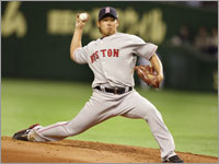 Daisuke Matsuzaka wheels and deals against the Oakland Athletics in the Tokyo Dome. (Barry Chin/Globe Staff)