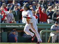 Manny Ramirez headed for home after a throwing error by Placido Polanco scored him following his triple to center field.