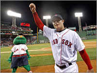 As Jon Lester salutes the crowd, Wally the Green Monster revels in the magic of Lester's no-hitter against the Kansas City Royals.