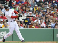 Red Sox slugger and third baseman Mike Lowell connects on a grand slam against the Kansas City Royals.